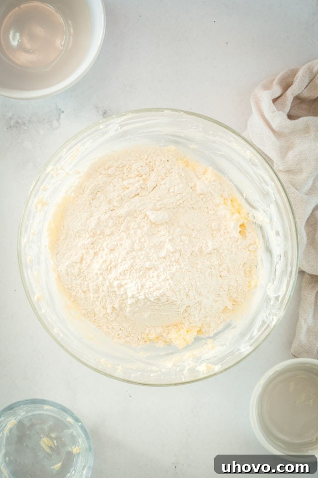 Overhead view of dry ingredients and wet ingredients in mixing bowl