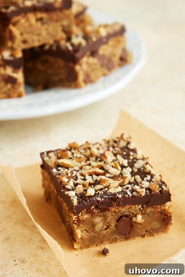 a chocolate chip blondie on a square of parchment paper