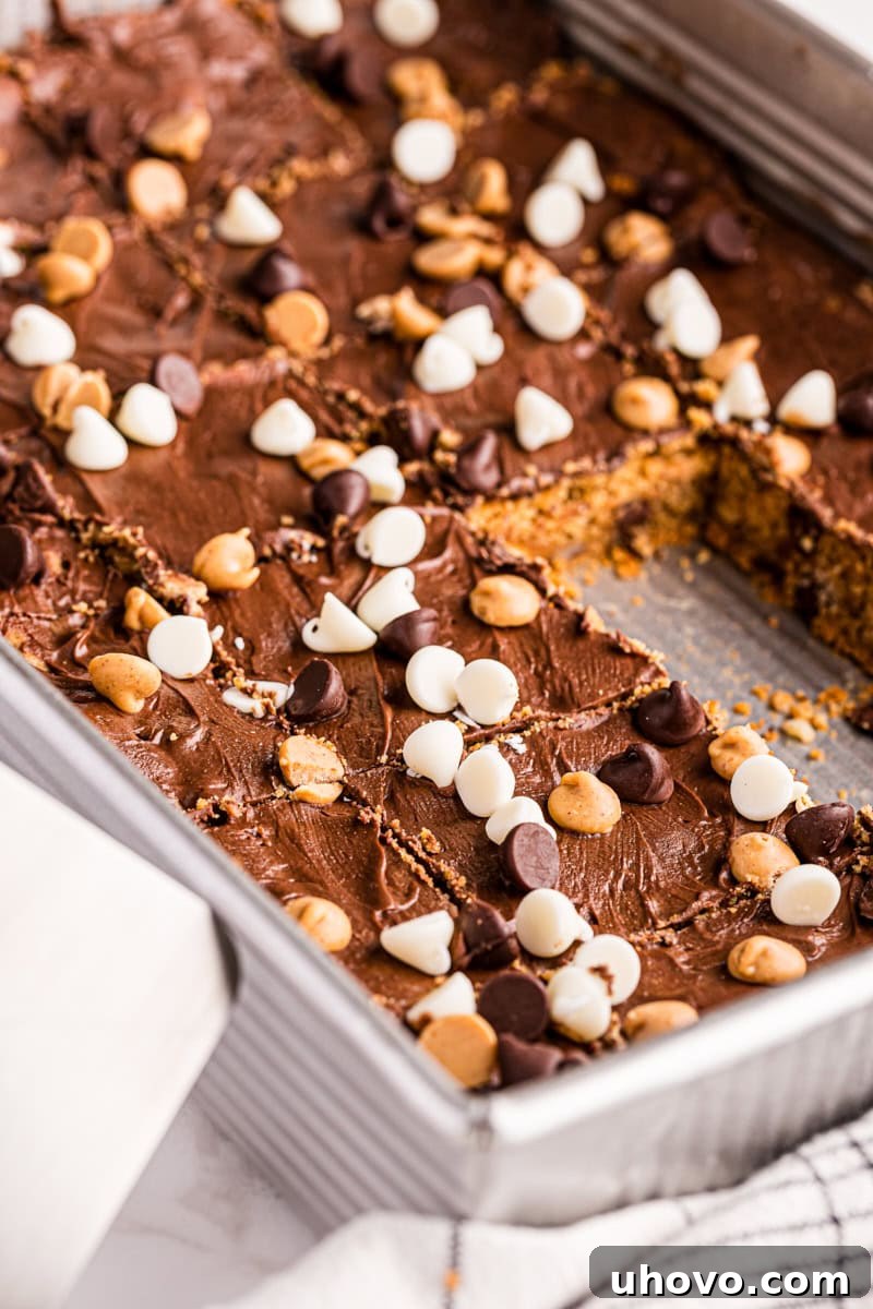 Peanut butter mud bars in pan, with some bars removed