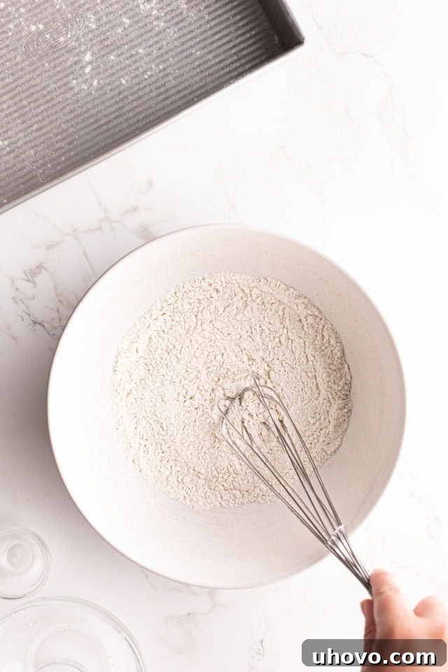 Whisking dry ingredients in mixing bowl
