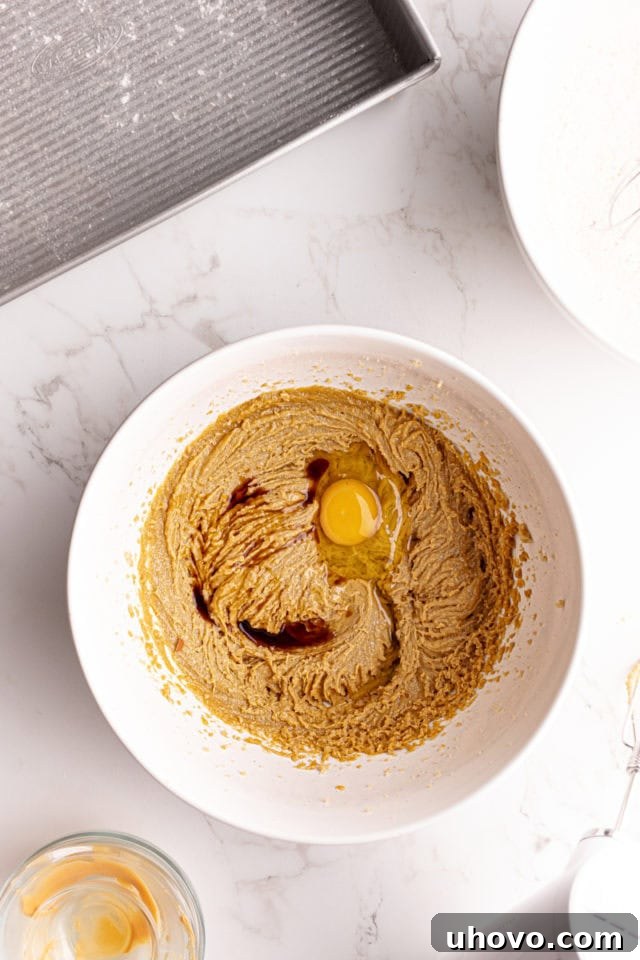 Vanilla and egg added to creamed butter and sugar