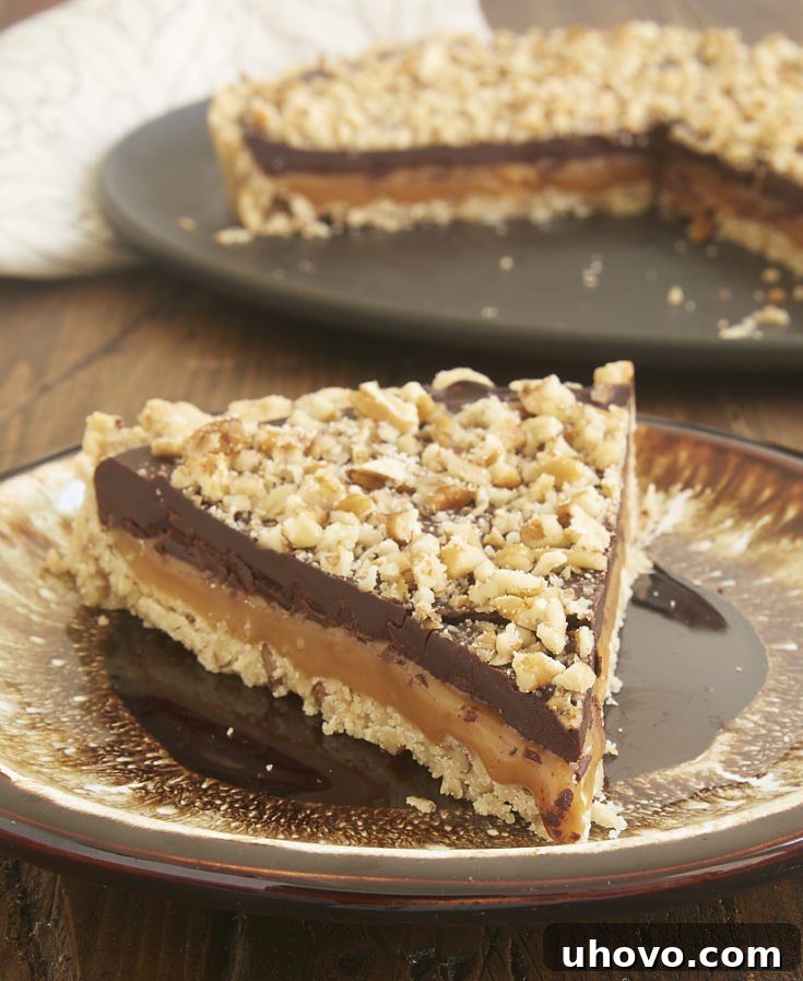 A pecan shortbread crust, a gooey layer of caramel, and a rich chocolate ganache make this Turtle Tart a can't-miss dessert! - Bake or Break