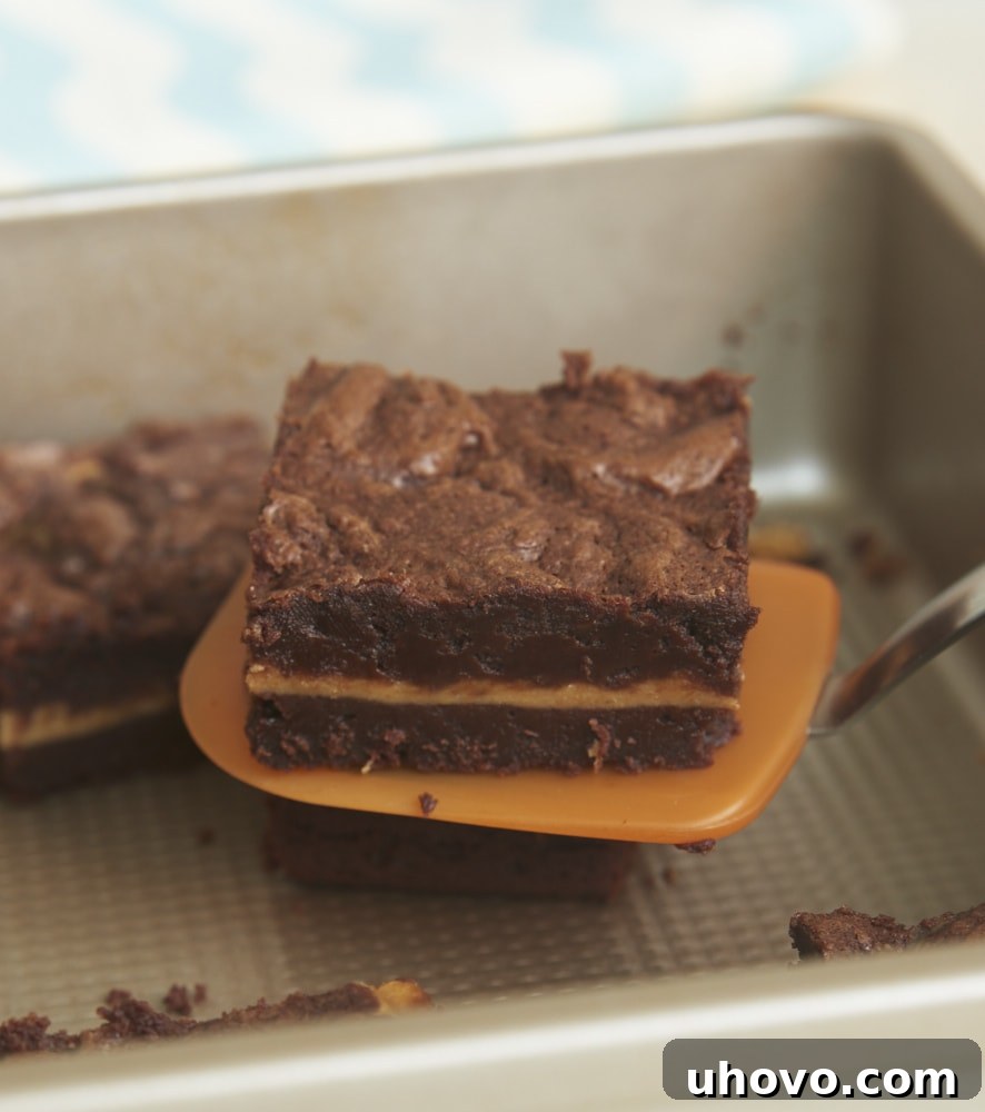 Dulce de Leche Cheesecake Brownies are extra fudgy brownies with a swirl of cheesecake filling flavored with dulce de leche. Absolutely fantastic! - Bake or Break