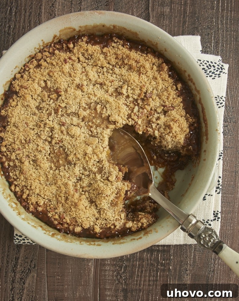 Delicious Pecan Pie Crisp with a buttery topping, perfect for any dessert lover.