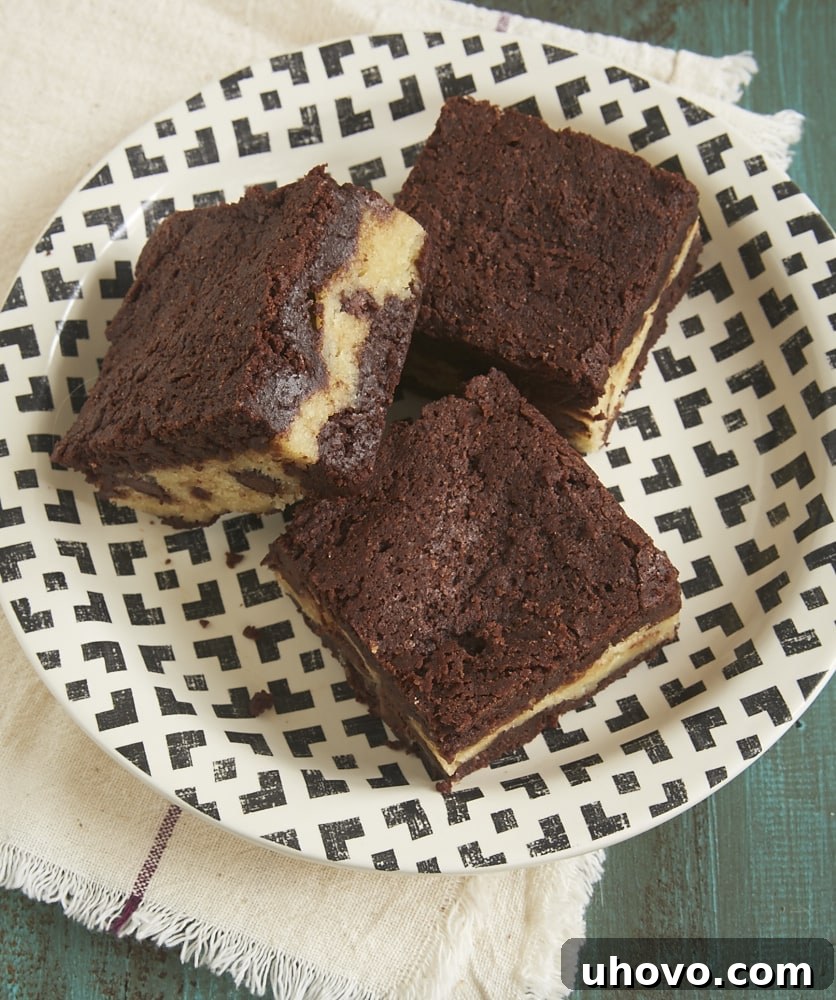 Chocolate Chip Cookie Stuffed Brownies on a modern black and white plate