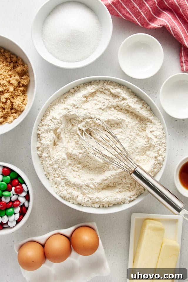 Mixed dry ingredients for Christmas M&M cookies.