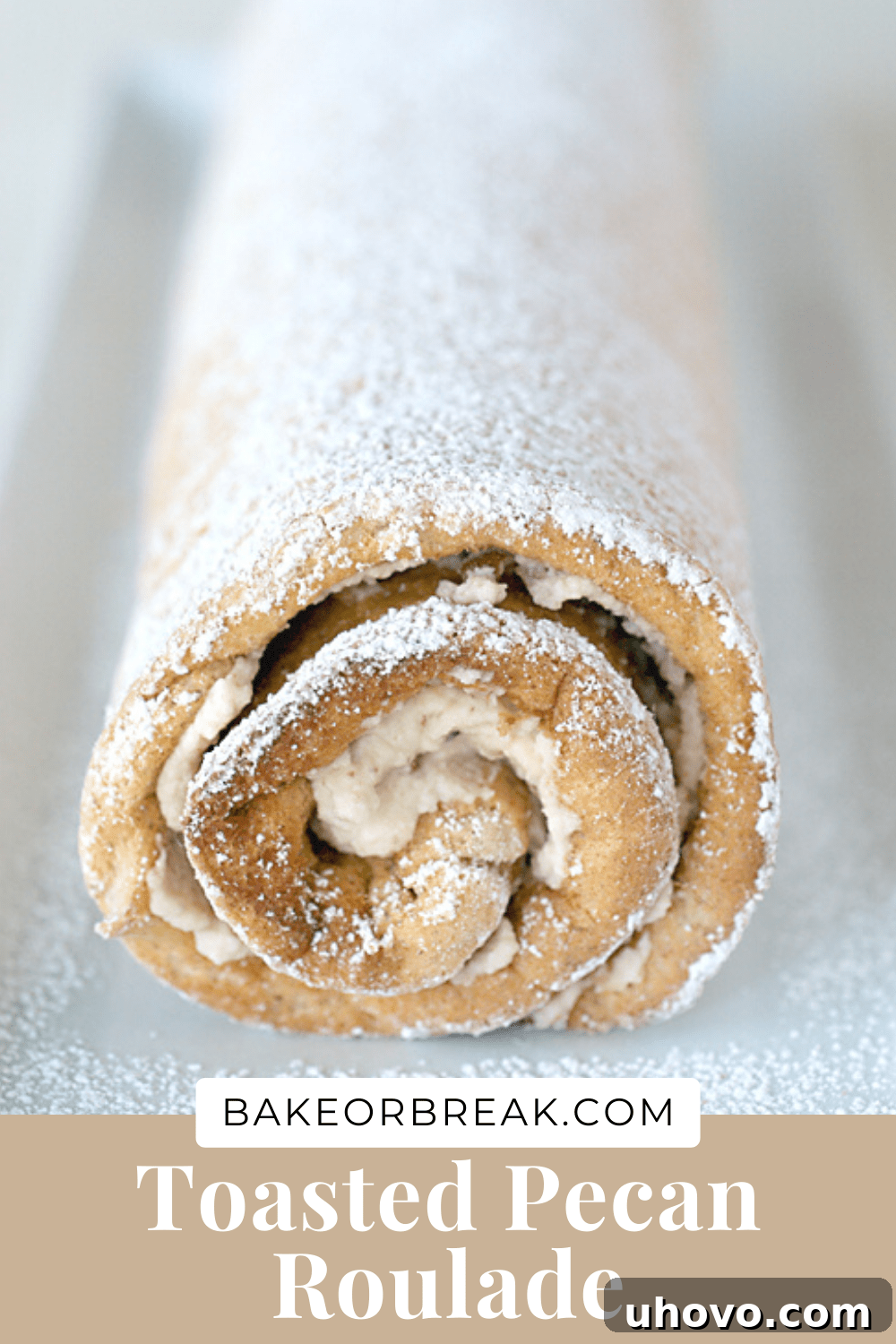 Toasted Pecan Roulade, a signature dessert from bakeorbreak.com, captured in a delightful bottom banner image, perfect for sharing.
