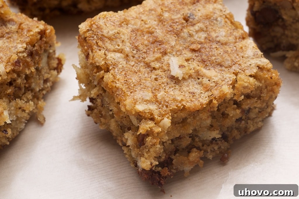 Delightful Coconut Pecan Blondies generously filled with toasted pecans, shredded coconut, and rich brown sugar, creating a perfect chewy and moist dessert bar.
