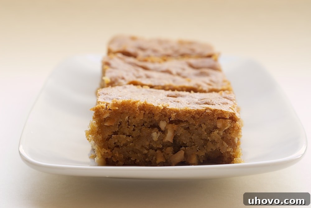 Perfectly sliced Brown Sugar Cashew Blondies arranged on a pristine white tray