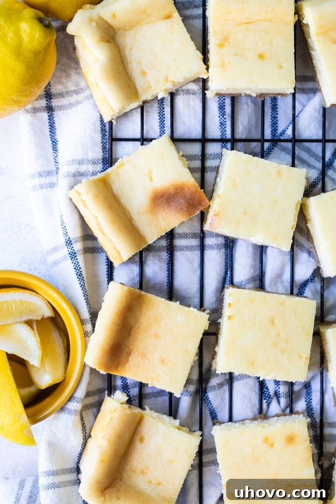 Overhead view of baked Limoncello Cheesecake Squares cooling on a wire rack