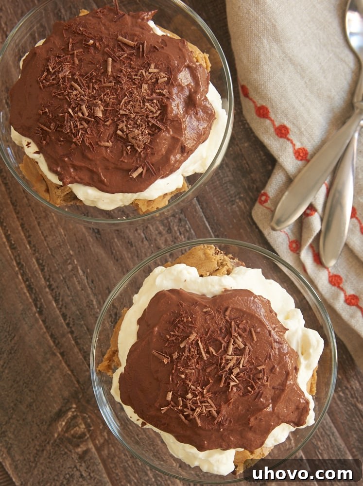 Individual Blondie Pudding Trifles generously topped with delicate chocolate shavings, ready for serving.
