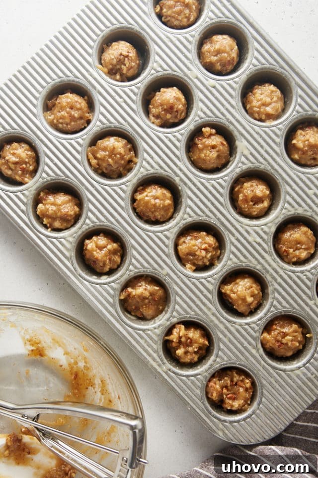 overhead view of Pecan Pie Cupcake batter in a mini muffin pan