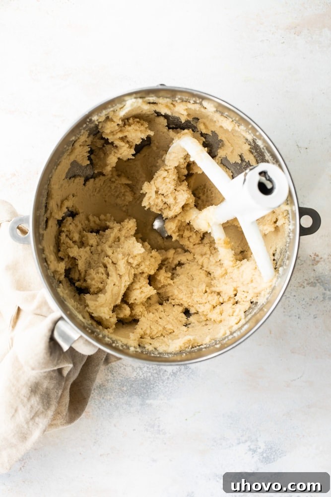 overhead view of creamed butter and brown sugar in a mixing bowl