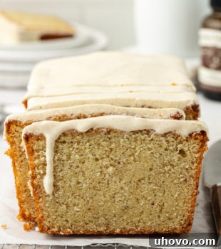 partially sliced brown butter pound cake on parchment paper