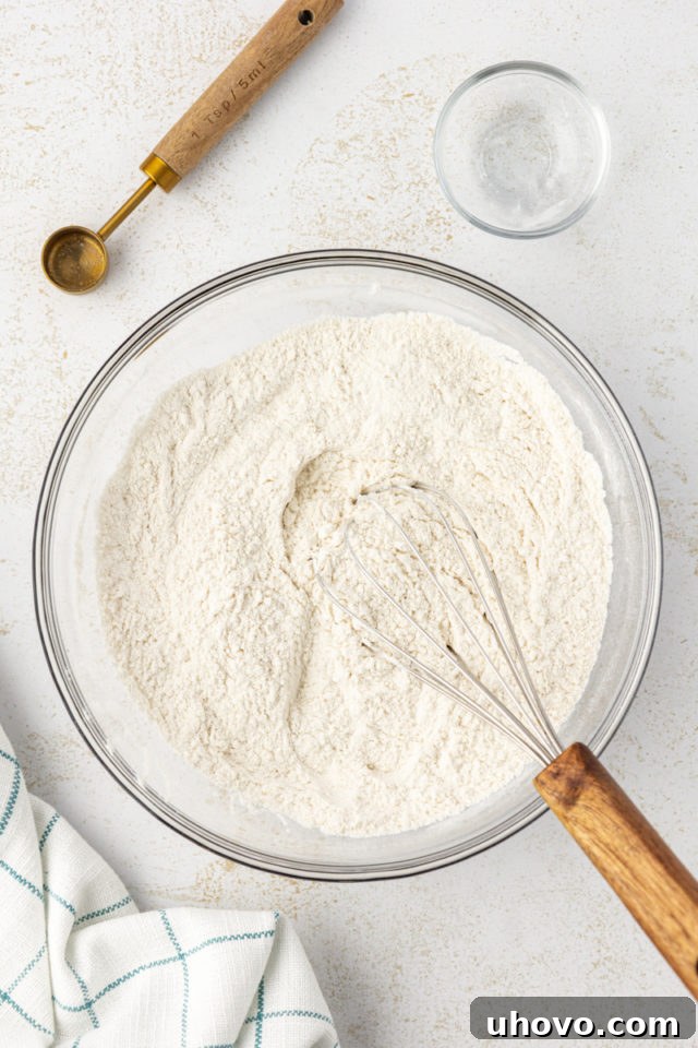 Overhead view of mixed dry ingredients for brown butter pound cake in a mixing bowl.