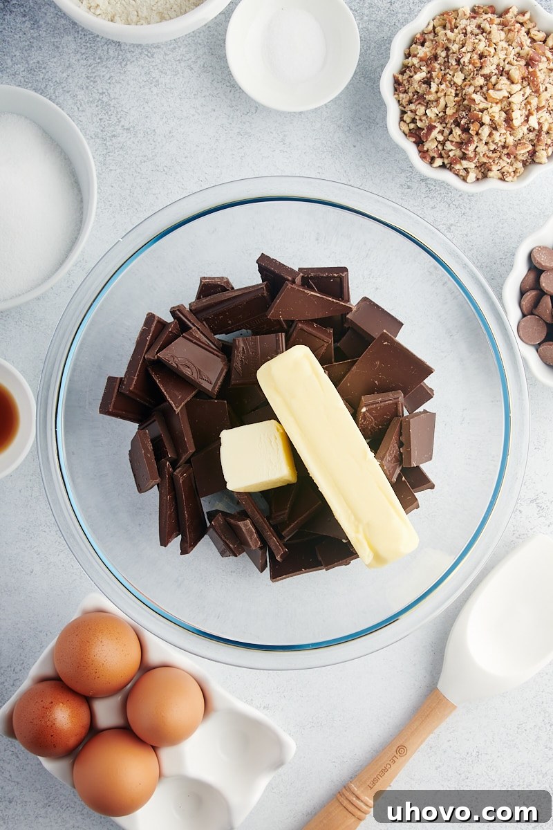 Overhead view of butter and chocolate in mixing bowl