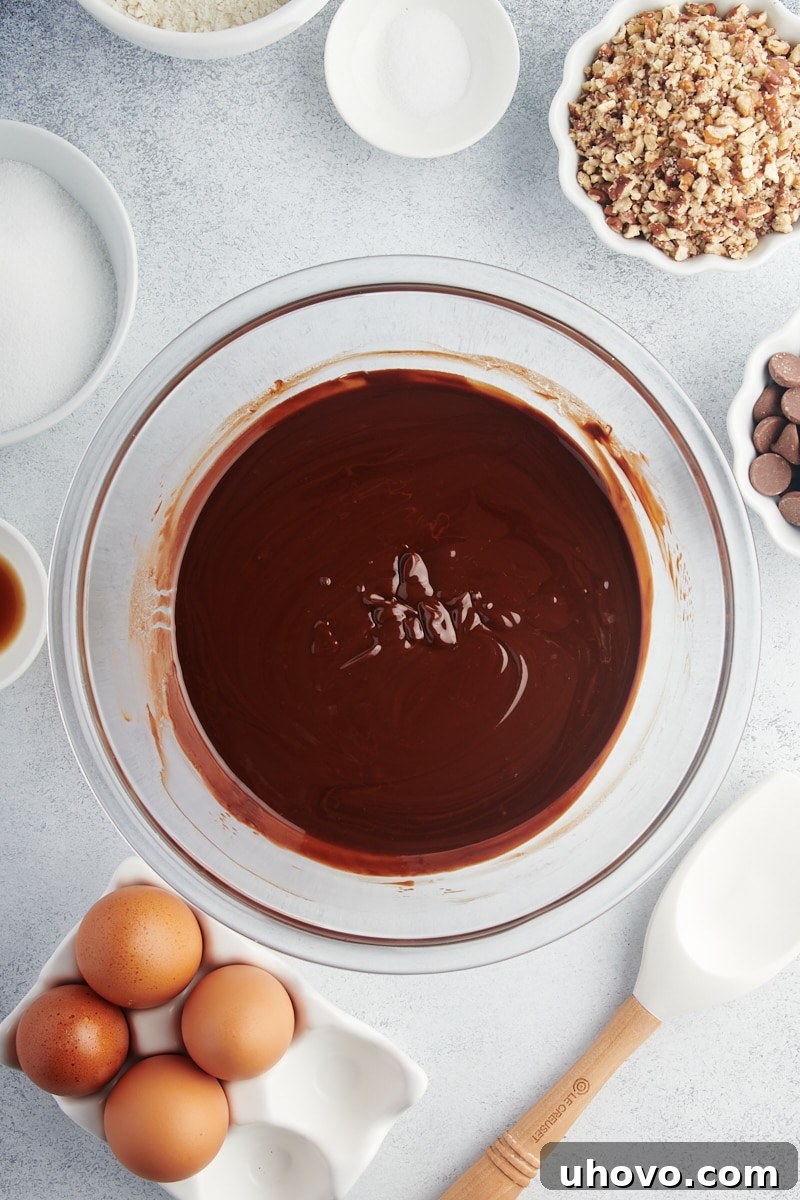 Overhead view of melted butter and chocolate in mixing bowl