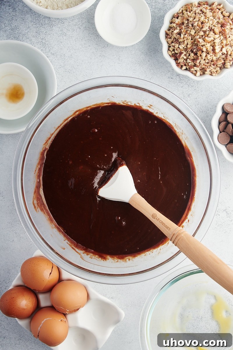 Overhead view of wet ingredients for brownies in mixing bowl