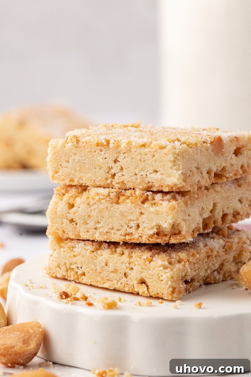 a stack of three macadamia shortbread on a white plate