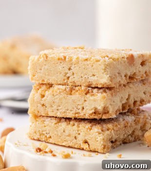 a stack of three macadamia shortbread on a white plate
