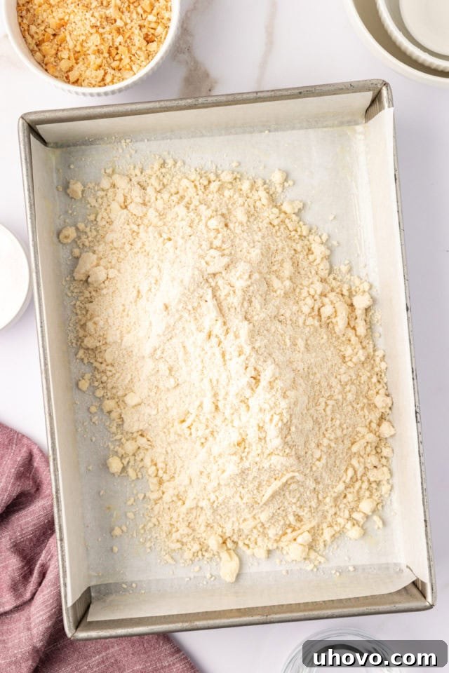 overhead view of macadamia shortbread dough in a baking pan