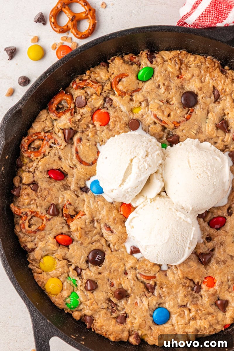 overhead view of a monster skillet cookie topped with three scoops of ice cream