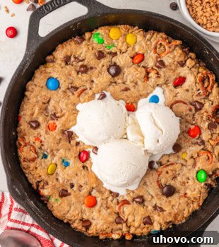 overhead view of monster skillet cookie in a cast iron skillet topped with ice cream