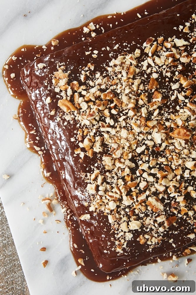An inviting overhead view of a golden-brown Cinnamon Pudding Cake, freshly baked and ready to be served on a pristine marble tray.
