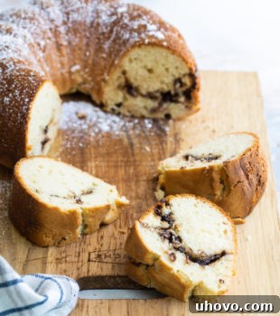 sliced Sour Cream Hazelnut Bundt Cake on a wooden cutting board