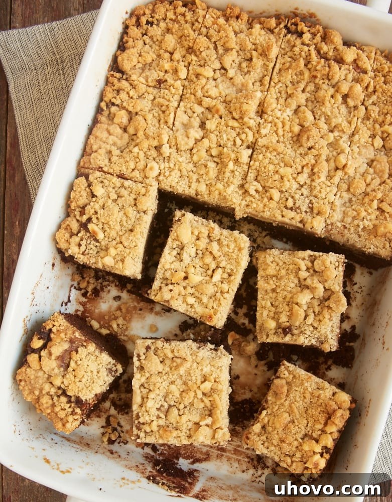 Close-up of a slice of Chocolate Cream Cheese Coffee Cake revealing layers of chocolate cake, cream cheese swirl, and crumb topping
