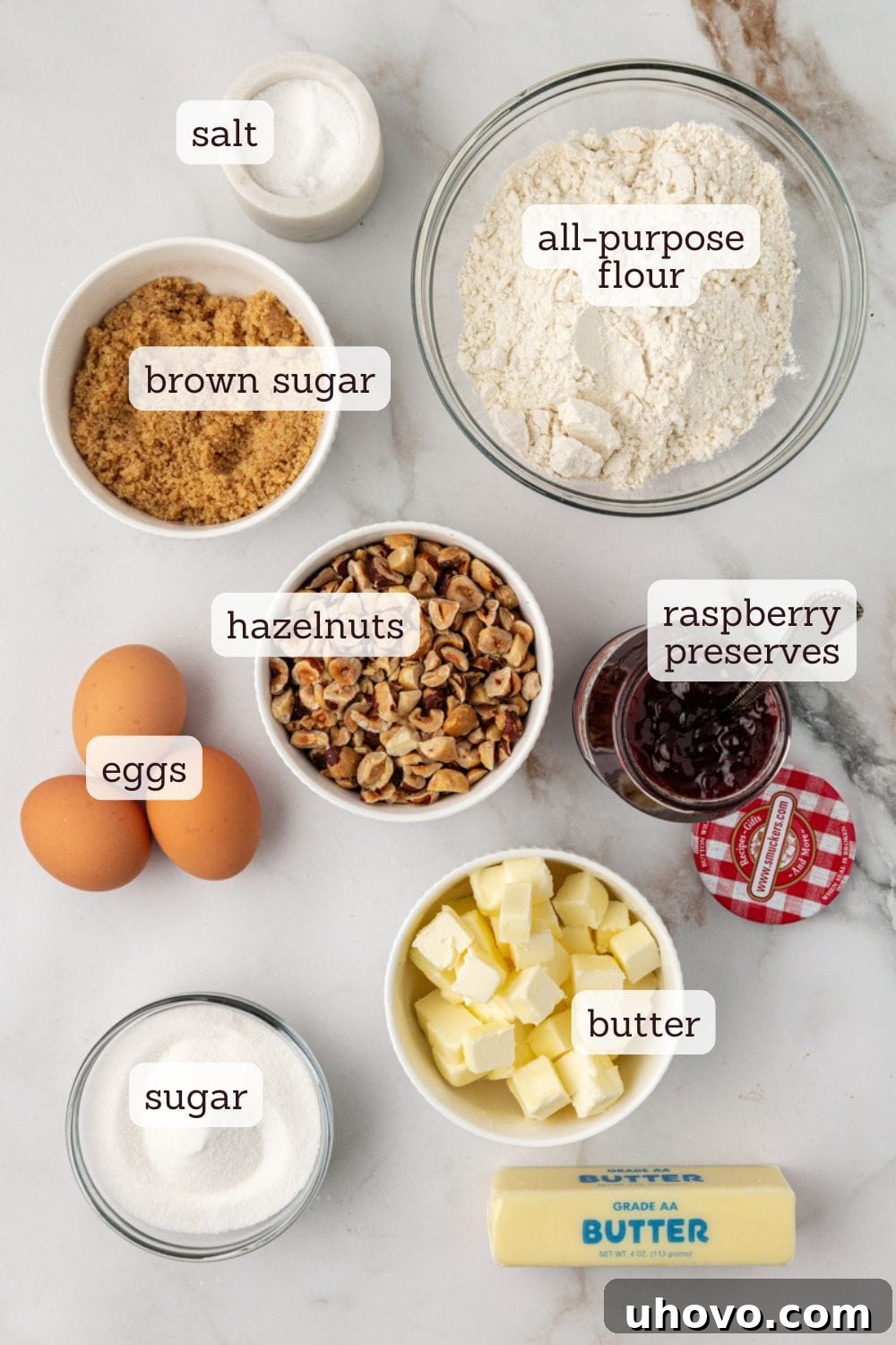 Overhead view of fresh ingredients for raspberry crumble bars, beautifully arranged with labels