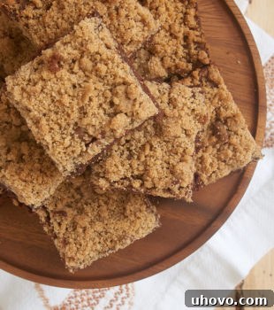 Cinnamon Crumb Brownies on a wooden serving plate, ready to be enjoyed