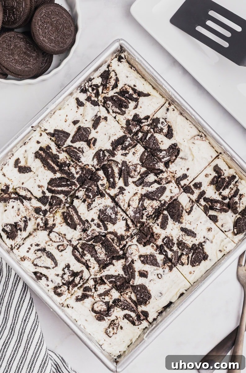 overhead view of sliced Oreo cheesecake bars in the pan