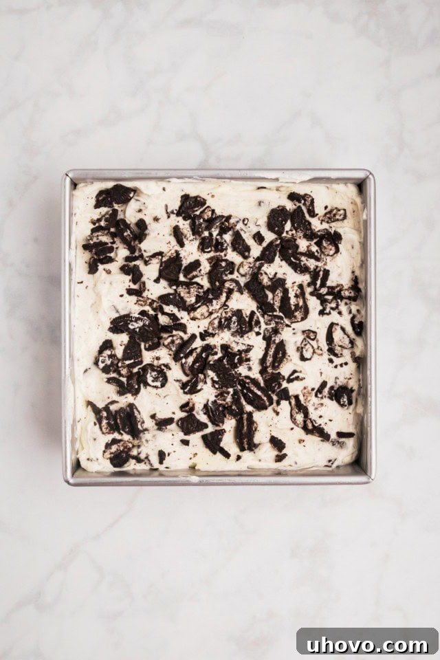 overhead view of Oreo cheesecake bars ready to be chilled