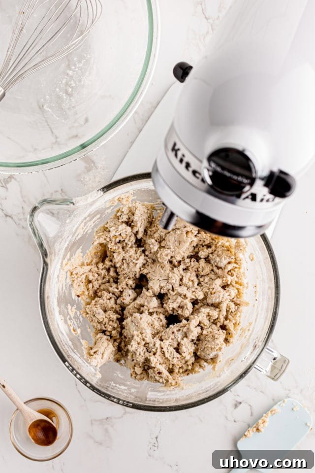 The finished cream cheese shortbread cookie dough in a stand mixer bowl, perfectly combined.