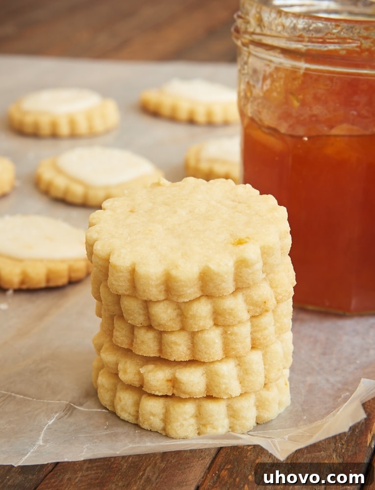 A charming stack of freshly baked peach shortbread cookies, each perfectly glazed.