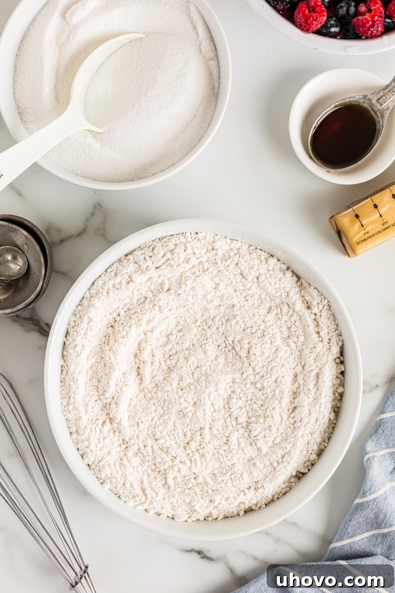 Overhead view of dry cake ingredients in mixing bowl