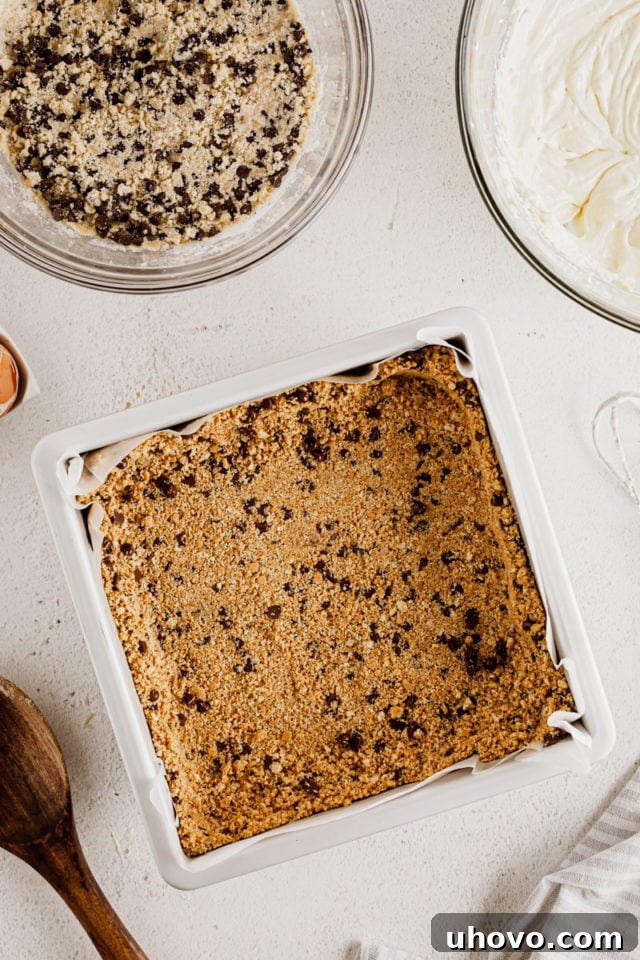 Overhead view of cheesecake bar crust in pan