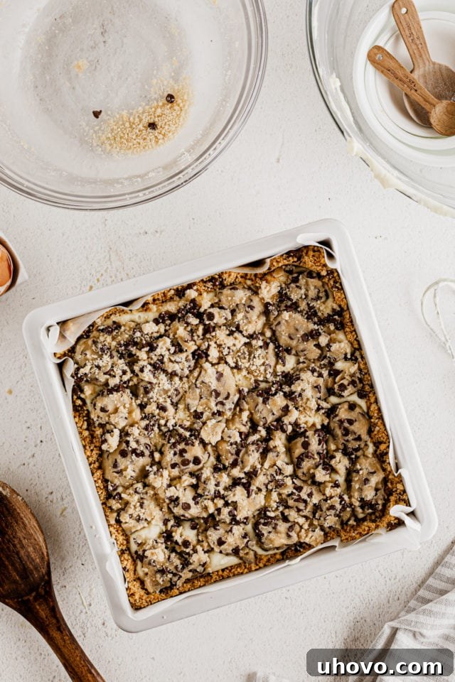 Overhead view of cookie dough cheesecake bars in pan