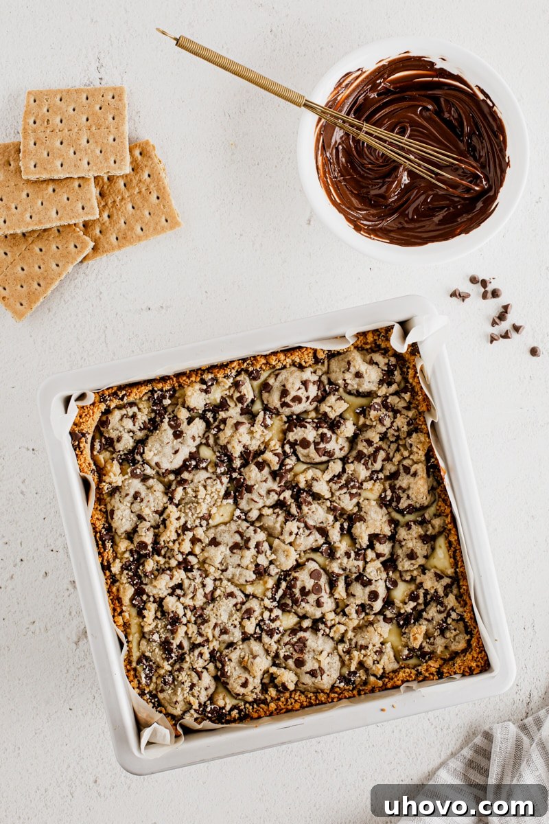 Overhead view of cookie dough cheesecake bars in pan