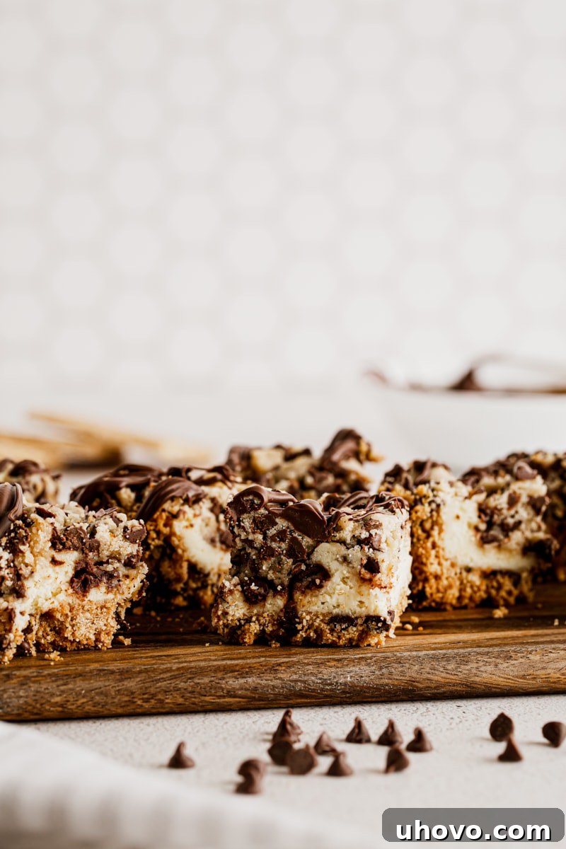 Chocolate chip cookie dough cheesecake bars on cutting board