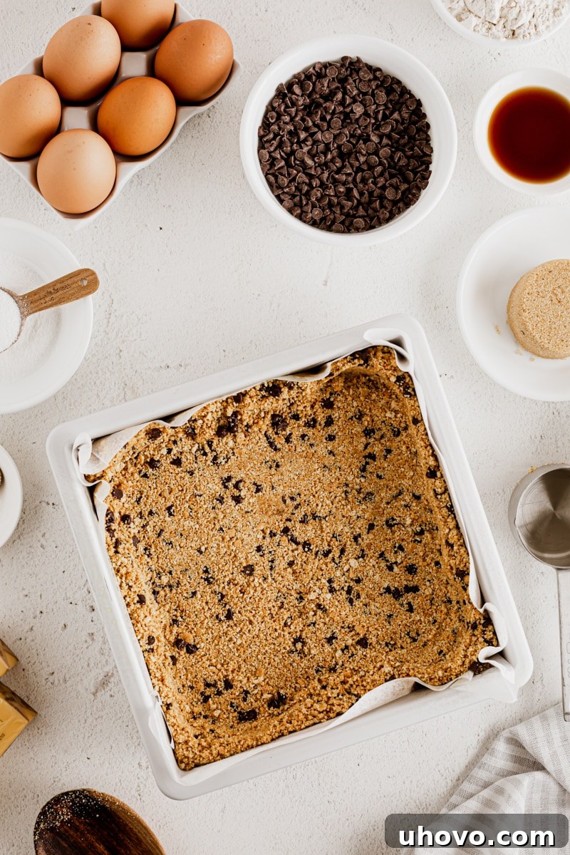 Overhead view of cheesecake bar crust in pan