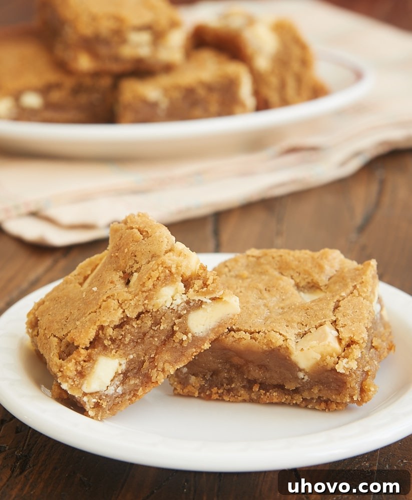 Slice of Peanut Butter White Chocolate Blondie showing chewy texture