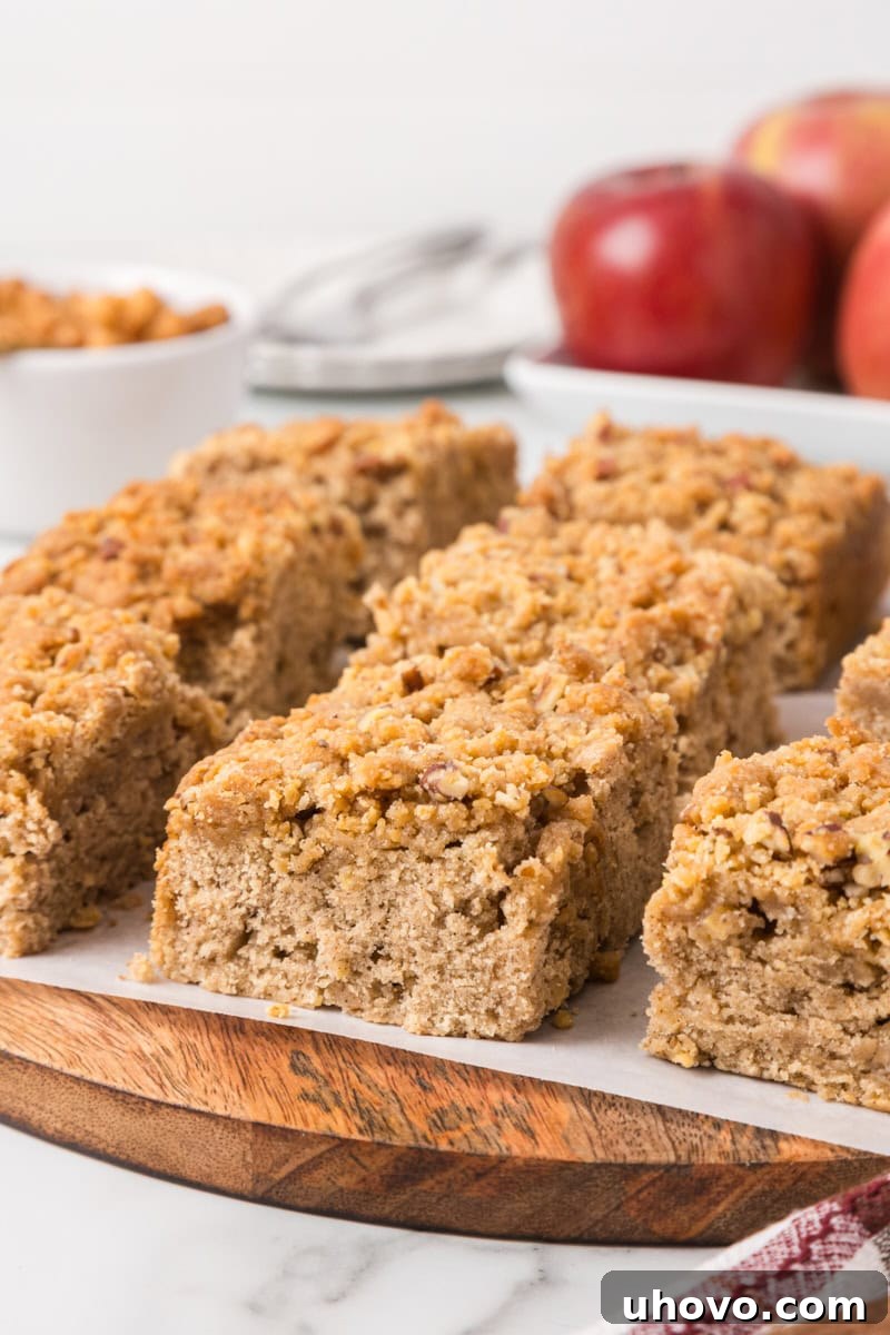 Caramel apple crumb cake squares on a serving platter for fall entertaining