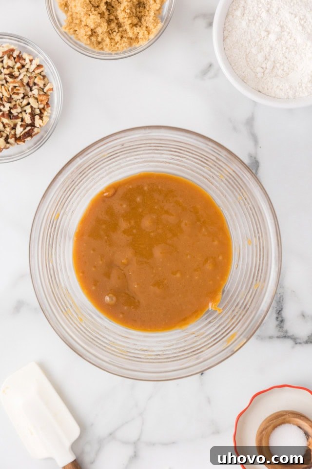 overhead view of melted caramel and butter in a glass bowl