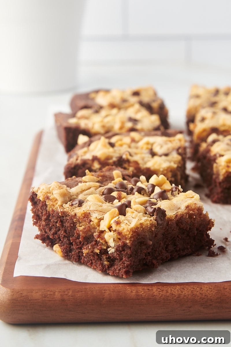Chewy peanut butter swirl brownies on wood board