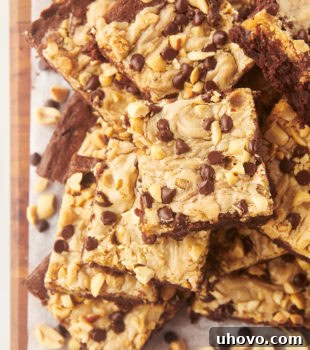 Overhead view of peanut butter swirl brownies stacked on board