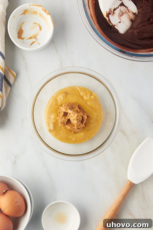Overhead view of batter and peanut butter in bowl