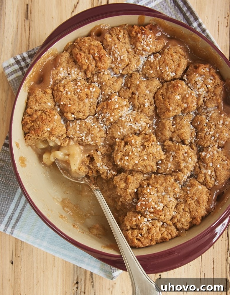 Autumn Spice Pear Cobbler in a red ceramic baker