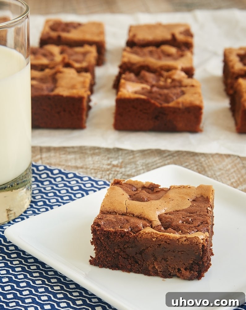 The stunning marbled pattern of Dark and Milk Chocolate Brownies, combining contrasting chocolate flavors into one beautiful dessert.